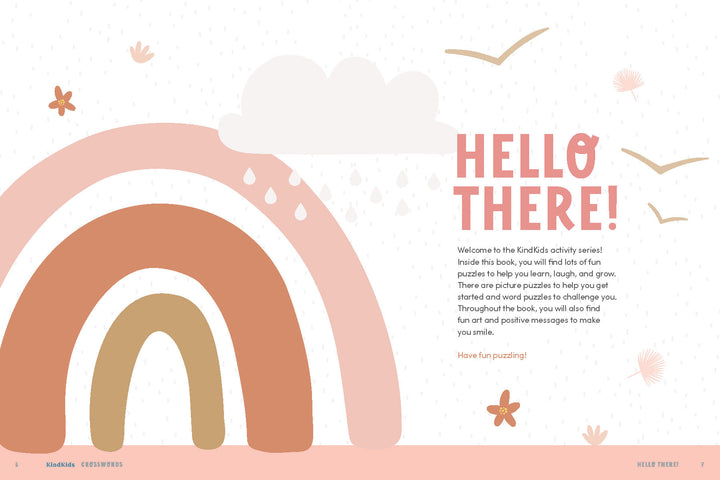 A pastel-colored illustration with a rainbow, raindrops, sun, and birds appears on the left; “HELLO THERE!” and a welcome message in orange and gray are on the right. Ideal for positive messages or kids activity books like Schiffer Publishing's KindKids Crosswords.