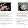 An open book, "The Art of Flower Therapy" by Schiffer Publishing, Ltd., shows step-by-step instructions with photos—hands placing pink flowers on a grater and a bowl of water with petals—demonstrating soothing flower therapy rituals.